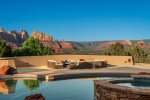 A beautiful double negative edge pool is perched for ultimate mountain views